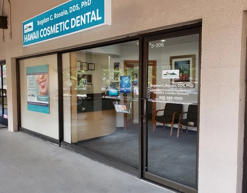 The Hawaii Cosmetic Dental storefront in Manoa Marketplace, with the practice sign above glass doors.